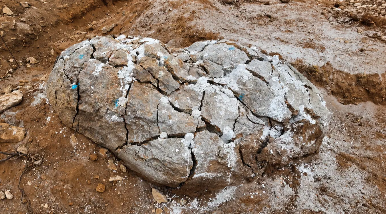 Rock cracked and broken apart cleanly after chemical treatment